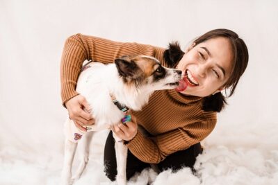 Owner getting lick by her dog