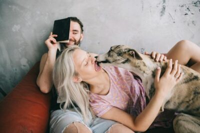 A Woman Holding her Pet Dog
